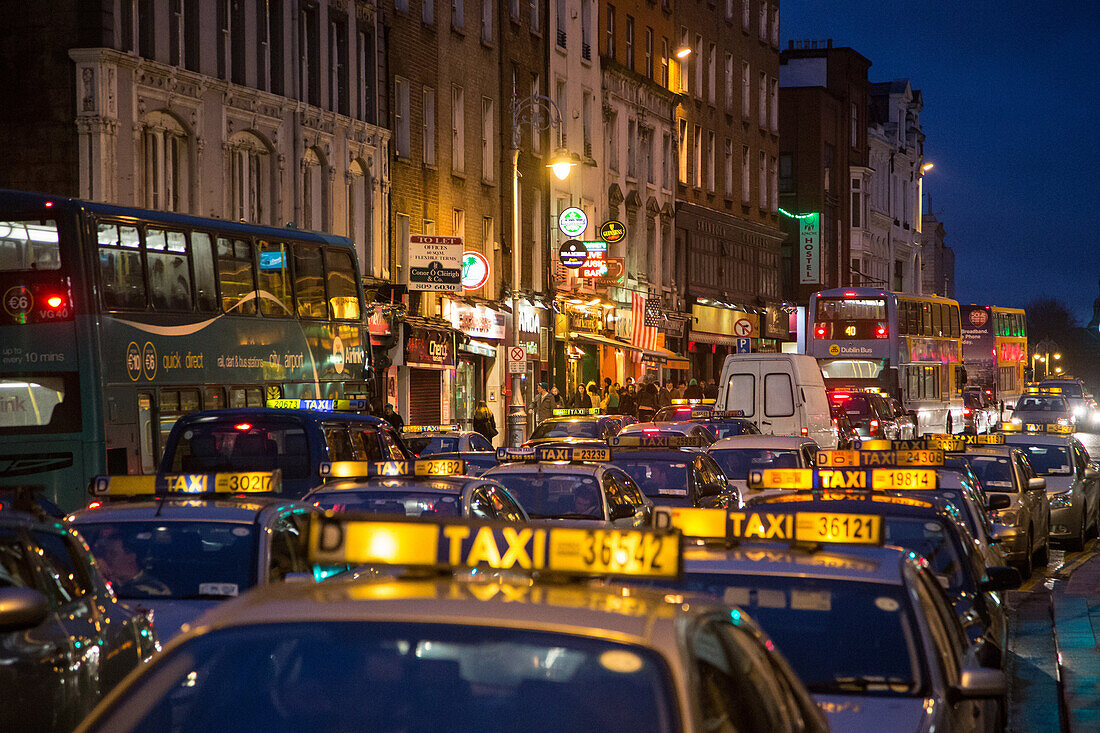 Taxi traffic jam on dame street at night, dublin, ireland