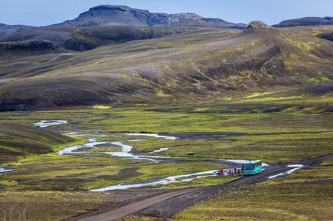 Bus of tourists in the region of the fjallabak mountains, nature reserve encompassing landmannalaugar, trail in the highlands of iceland, southern iceland, europe