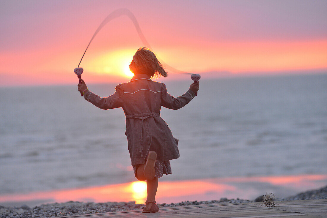Little girl jumping rope, somme, picardy, france