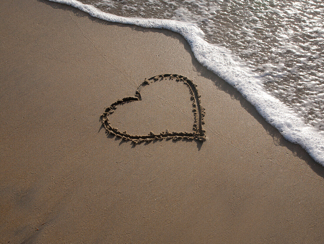 Heart Shape Drawn in Beach Sand