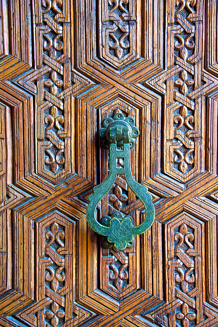 Detail of a wooden door and bronze knocker, Islamo-Andalucian art, Marrakech Museum, Marrakech, Morocco, North Africa, Africa