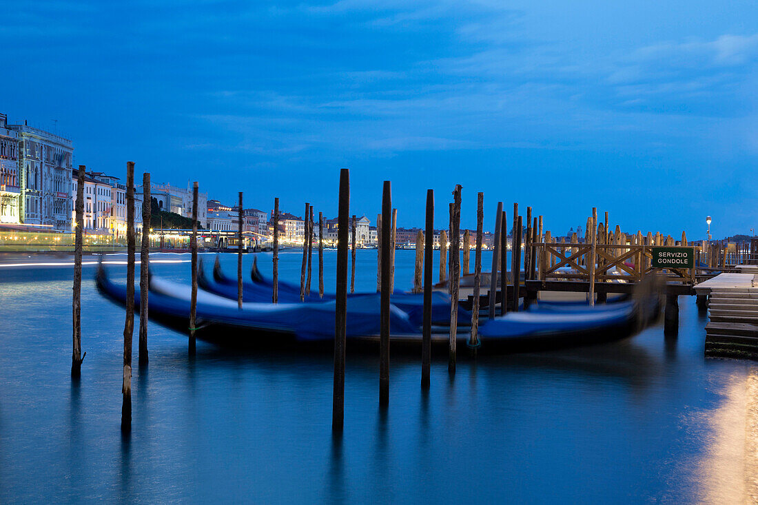 Gondolas moored at night at Campo della Salute on the Grand Canal, Venice, UNESCO World Heritage Site, Veneto, Italy, Europe