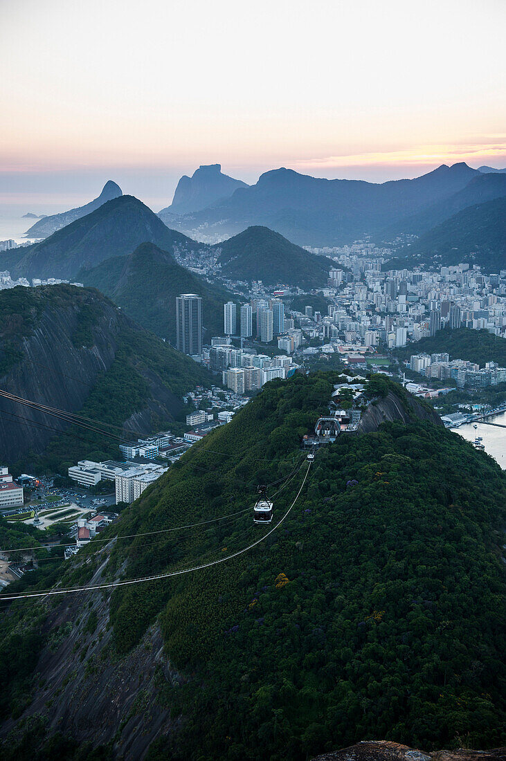 View from the Sugarloaf and the famous cable car at sunset, Rio de Janeiro, Brazil, South America