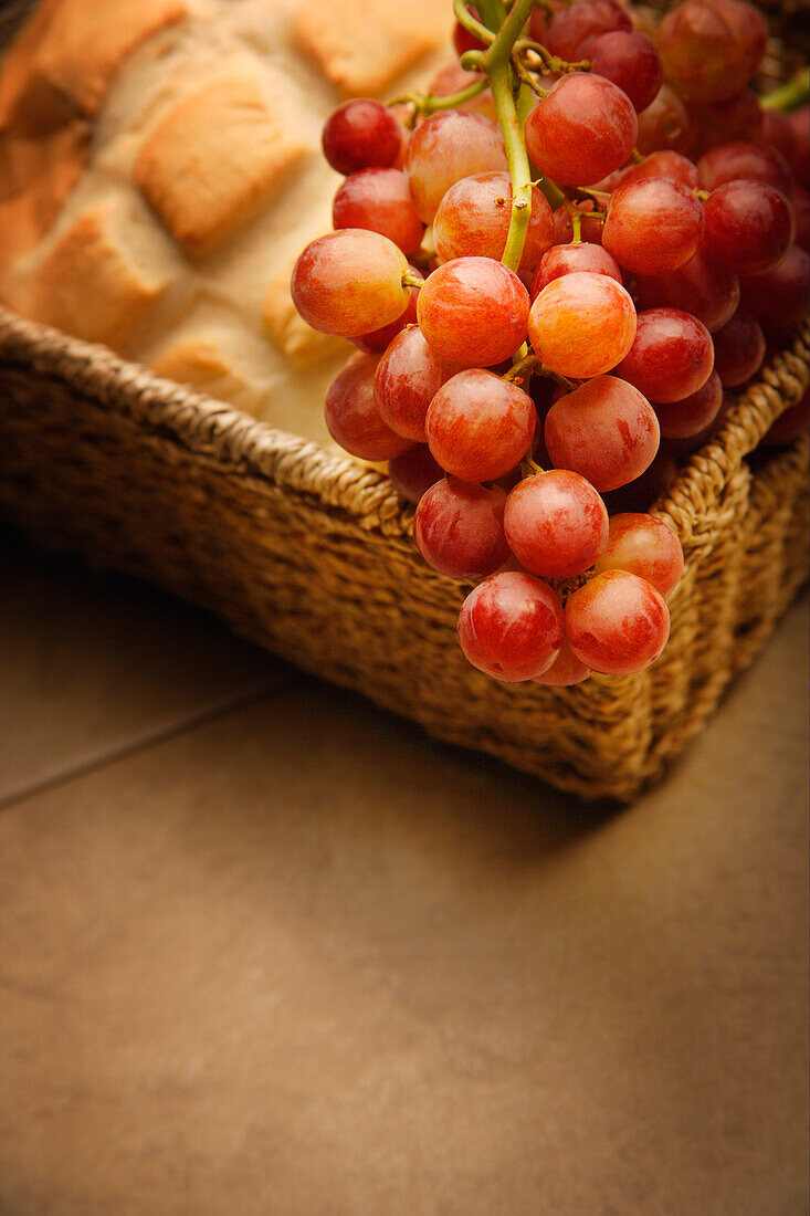 A Close-Up Of Grapes And Bread