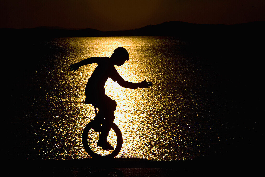 Silhouette Of Unicycle