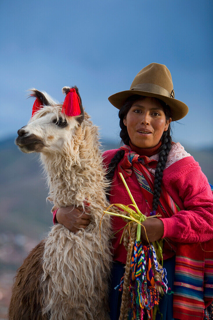 'Cuzco, Peru; Peruvian Woman And Her Llama (Lama Glama)'