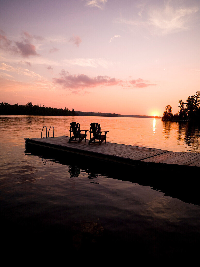 Lake Of The Woods, Ontario, Canada, Adirondack Chairs On A Dock