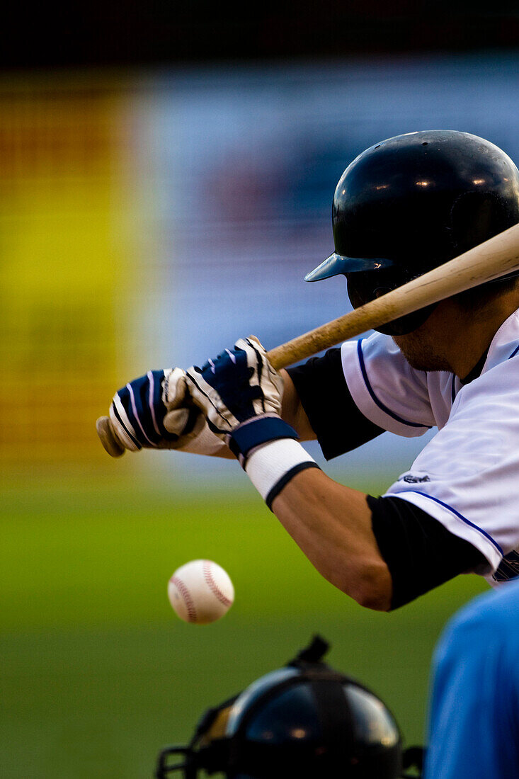 Man Playing Baseball