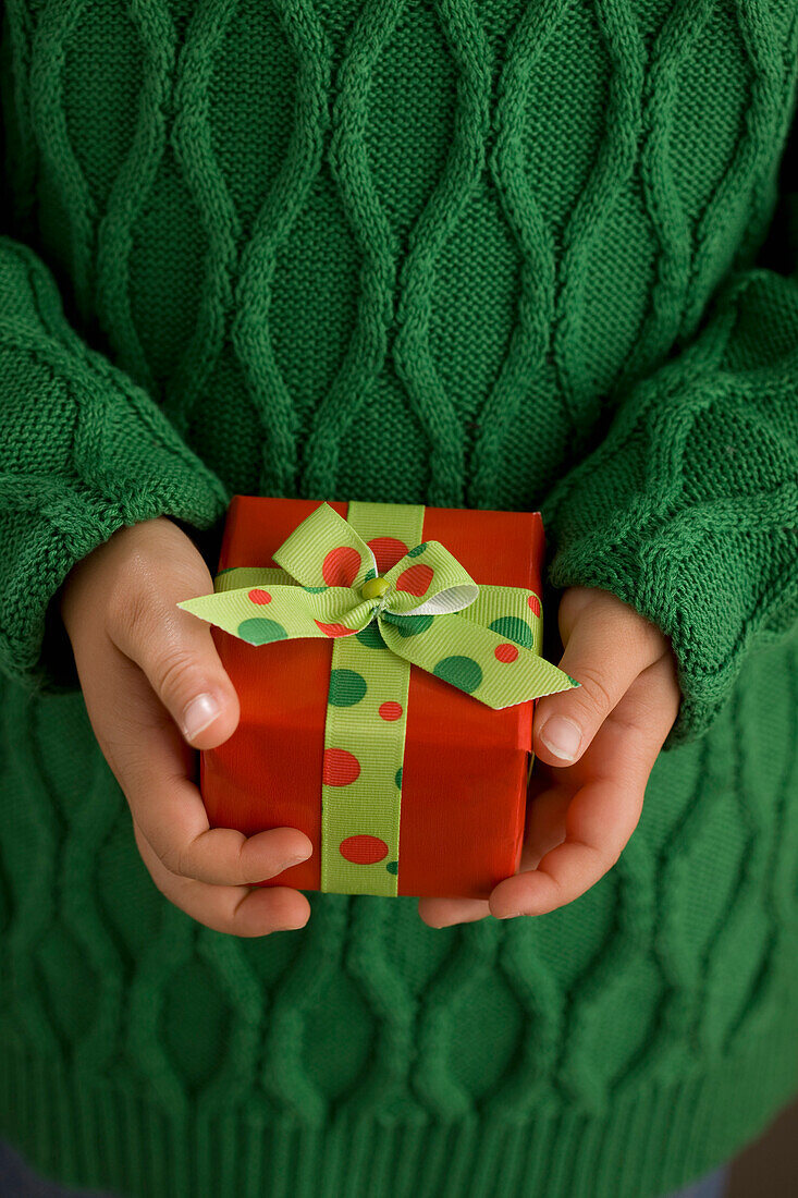 Child's Hands Holding A Present