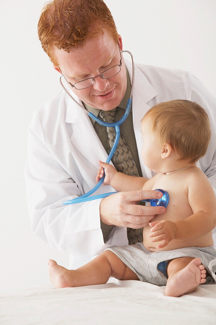 A Pediatrician Examining A Baby