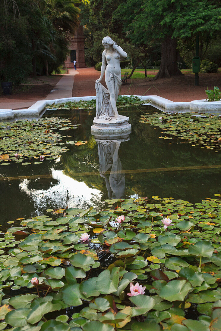 'Buenos Aires, Argentina; A Stone Statue In A Pond In The Palermo Botanical Gardens (Jardin Botanical)'