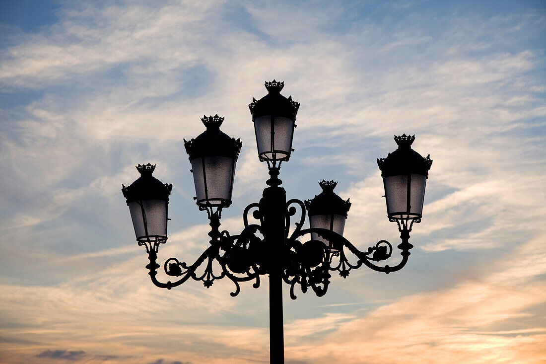 'Medina Sidonia, Andalusia, Spain; A Light Post With 5 Lamps On It'