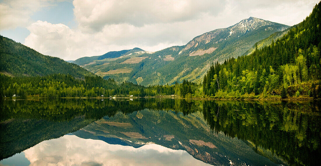 'Mountains Reflected In A Tranquil Lake; Golden British Columbia, Canada'