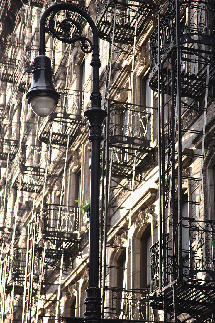 'Fire Escapes Going Up The Side Of A Building; Manhattan, New York City, New York, United States Of America'