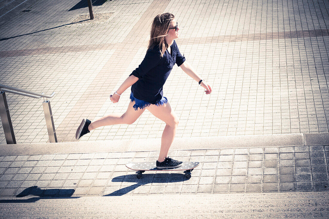 woman skating in the street, annecy, france