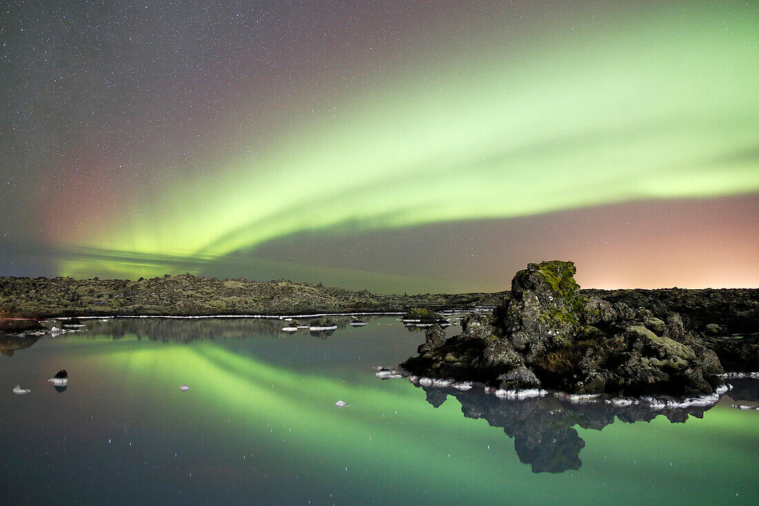 Iceland. Western region. Reykjanes Peninsula. Blue Lagoon geothermal sources. Starry sky. Aurora Borealis.