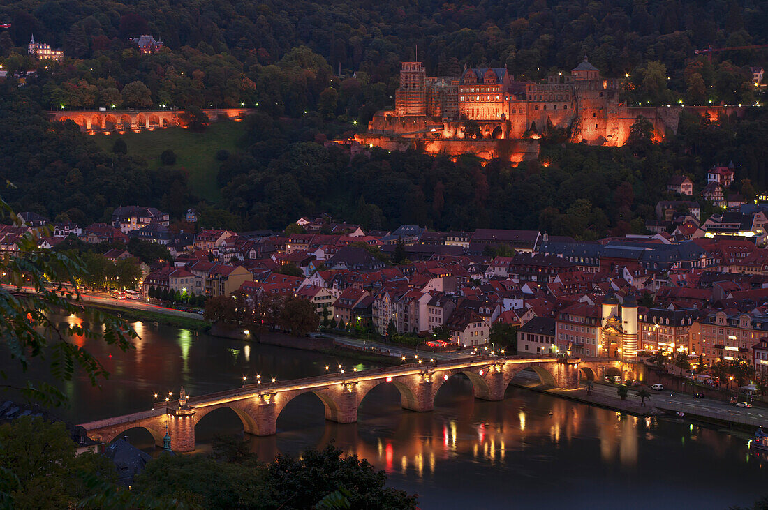 'View of the city of Heidelberg at nighttime and a bridge crossing the River Neckar; Heidelberg, Baden-Wurttemberg, Germany'