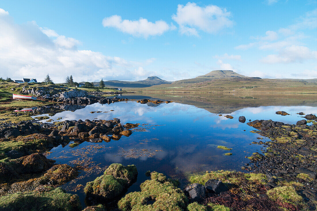 'Landscape of shoreline and tranquil water of the Isle of Skye; Skye, Scotland'