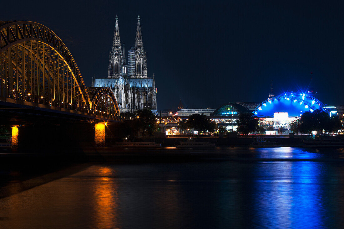 'Hohenzollern Bridge and Cologne Cathedral at nighttime; Cologne, Germany'