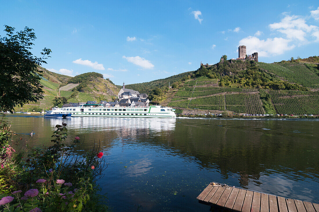 'A boat on Moselle river with vineyards on the slopes; Mosel, Germany'