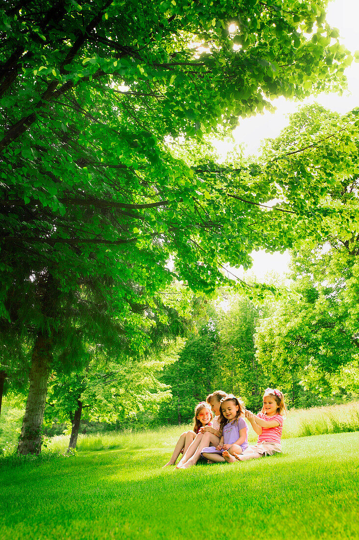 Four Girls Sitting On Lawn