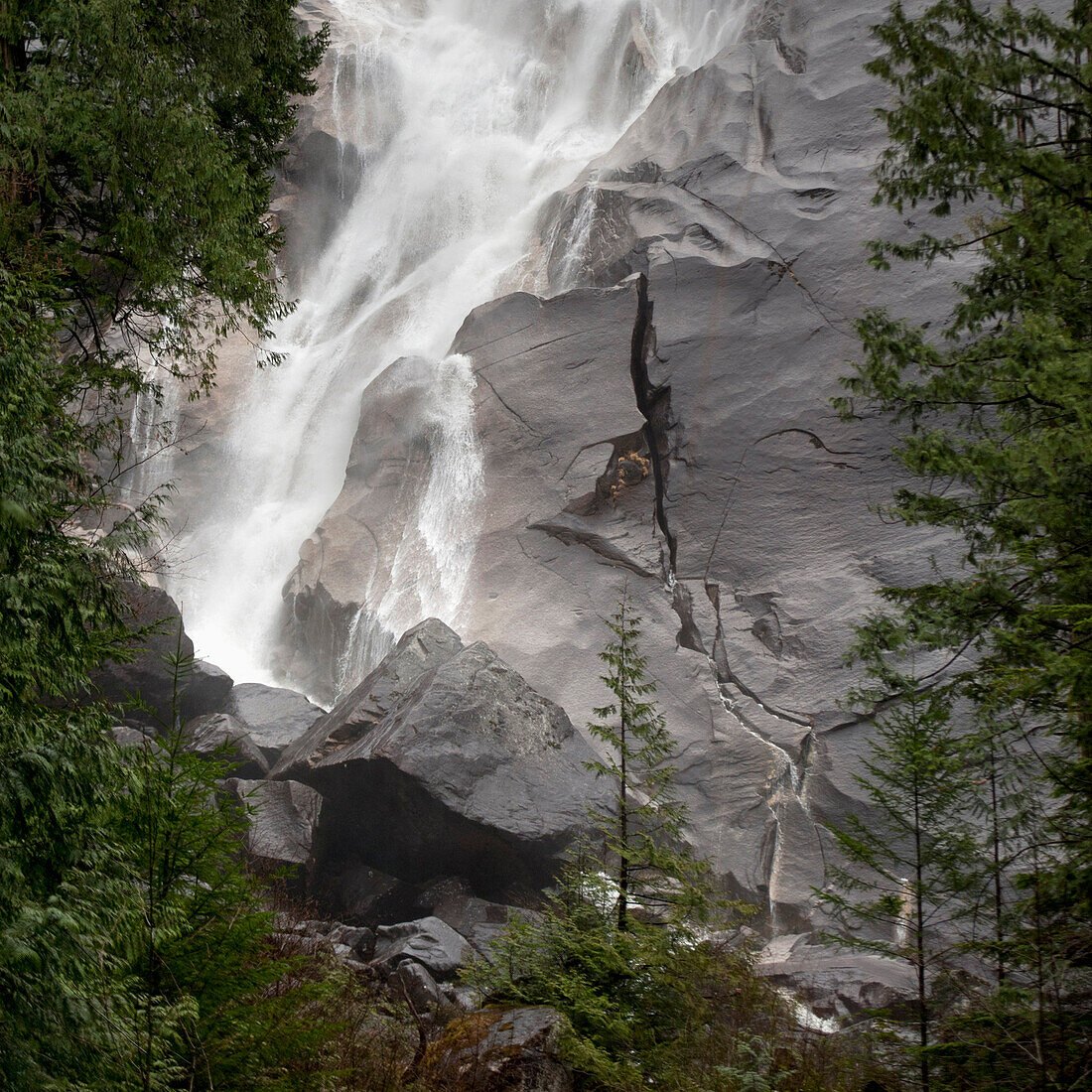 'Water Cascading Down The Rock And Forming A Mist In Jasper National Park; Alberta, Canada'