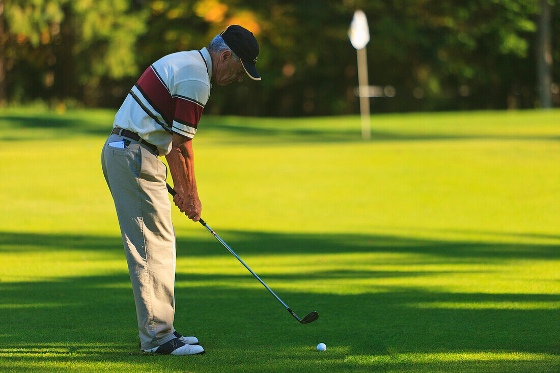 'A Man Golfing At Lynnwood Golf Course; Lynnwood, Washington, United States of America'