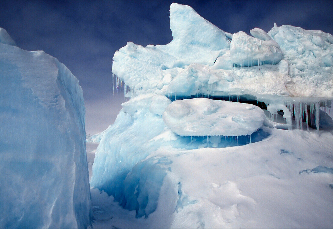 Iceberg Frozen Into The Arctic Ocean Near Griffith Island, Nunavut In The Canadian High Arctic.