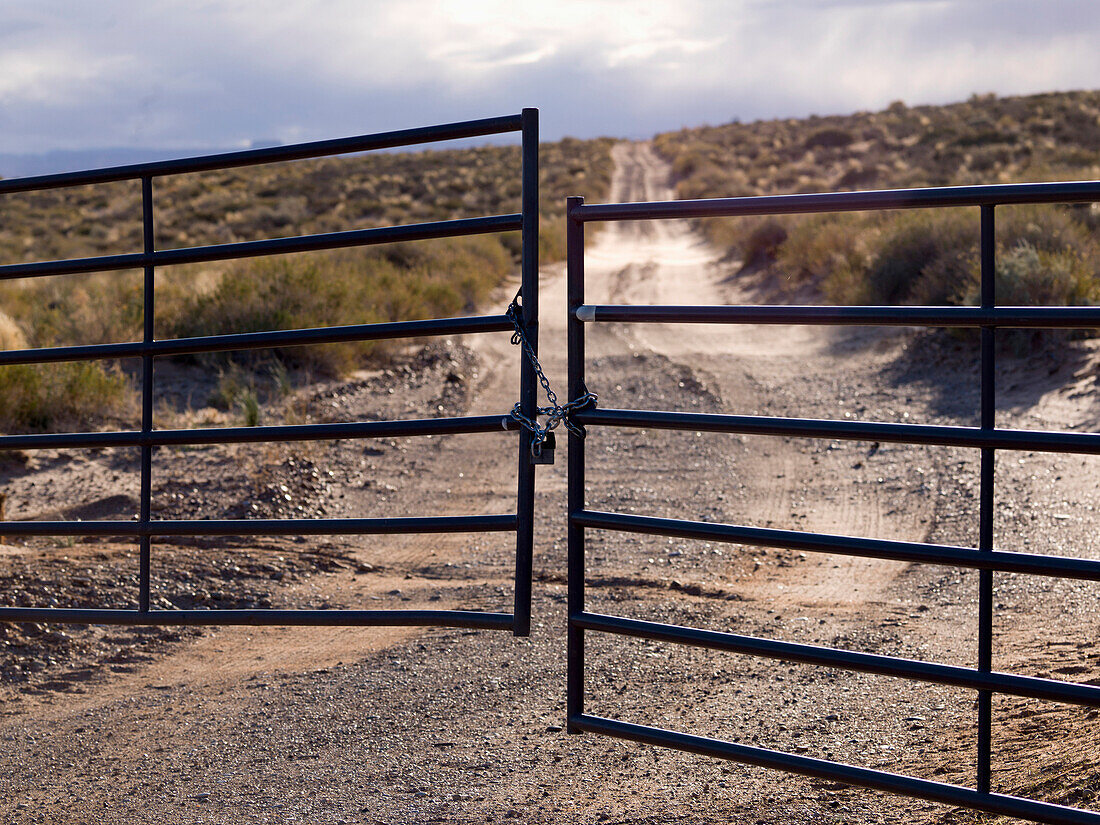 'Metal Gate Locked On A Dirt Road In Glen Canyon National Recreation Area; Utah, United States of America'