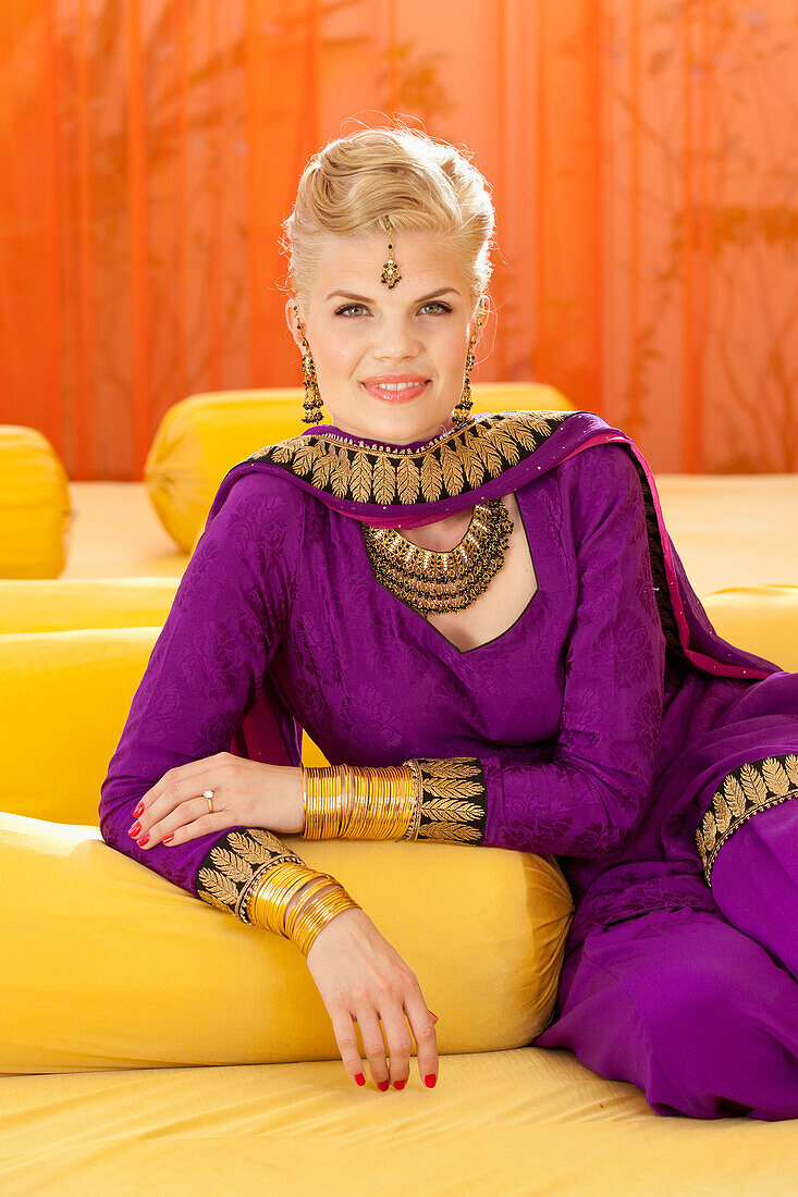 'A Woman Wearing A Purple Sari For A Pre-Wedding Mehndi Ceremony; Ludhiana, Punjab, India'