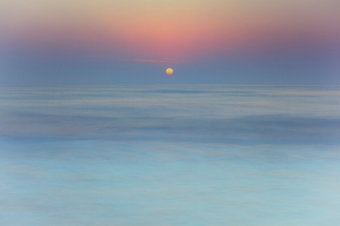 'Sun rising over blurred water;Spain'