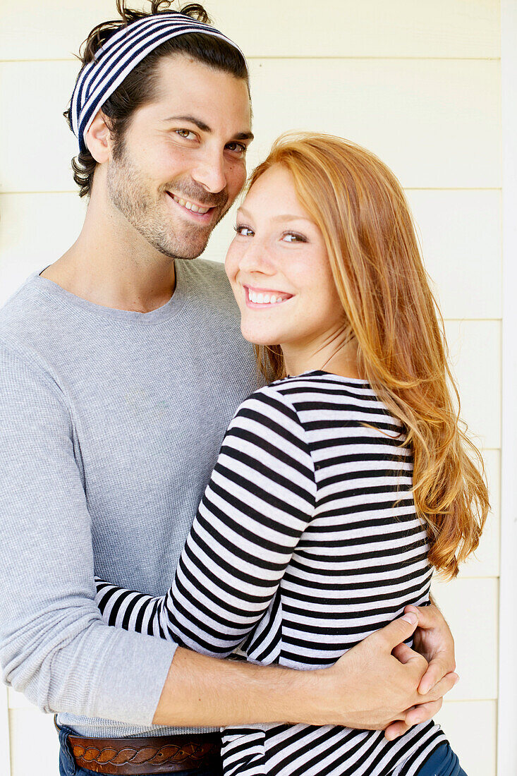 'Portrait of a couple with the man wearing the headband to match her shirt;Wailua kauai hawaii united states of america'