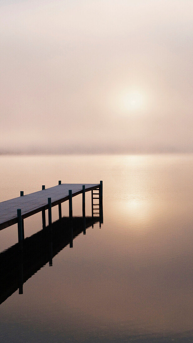 A Foggy Sunrise Over A Dock In Lake Whatcom During Winter, Bellingham Washington, Usa