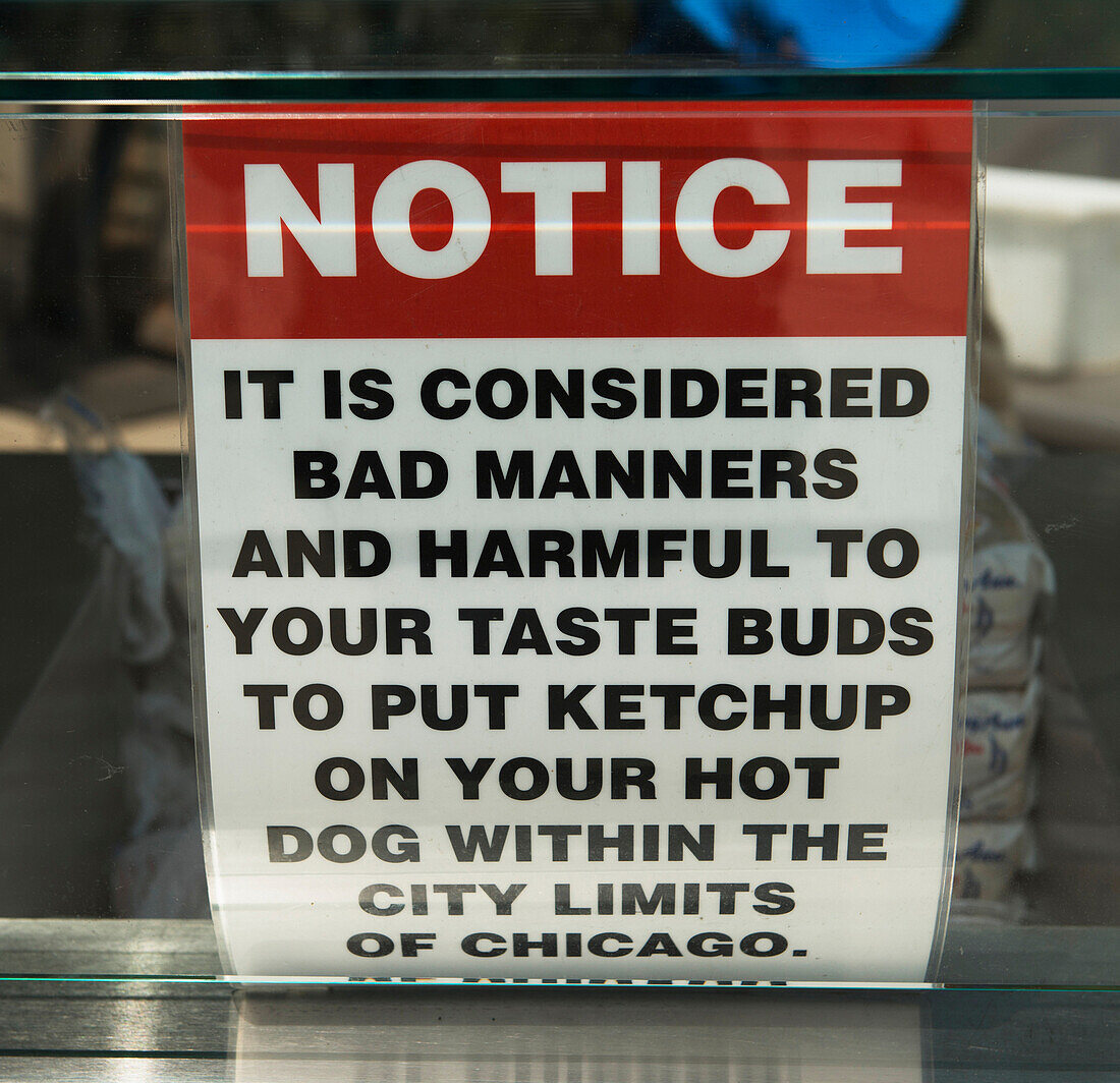 'Humorous sign about the use of ketchup on hot dogs;Chicago illinois united states of america'