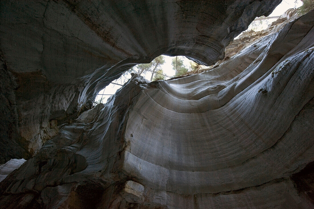 'View up to the sky from inside a cave;Alberta canada'