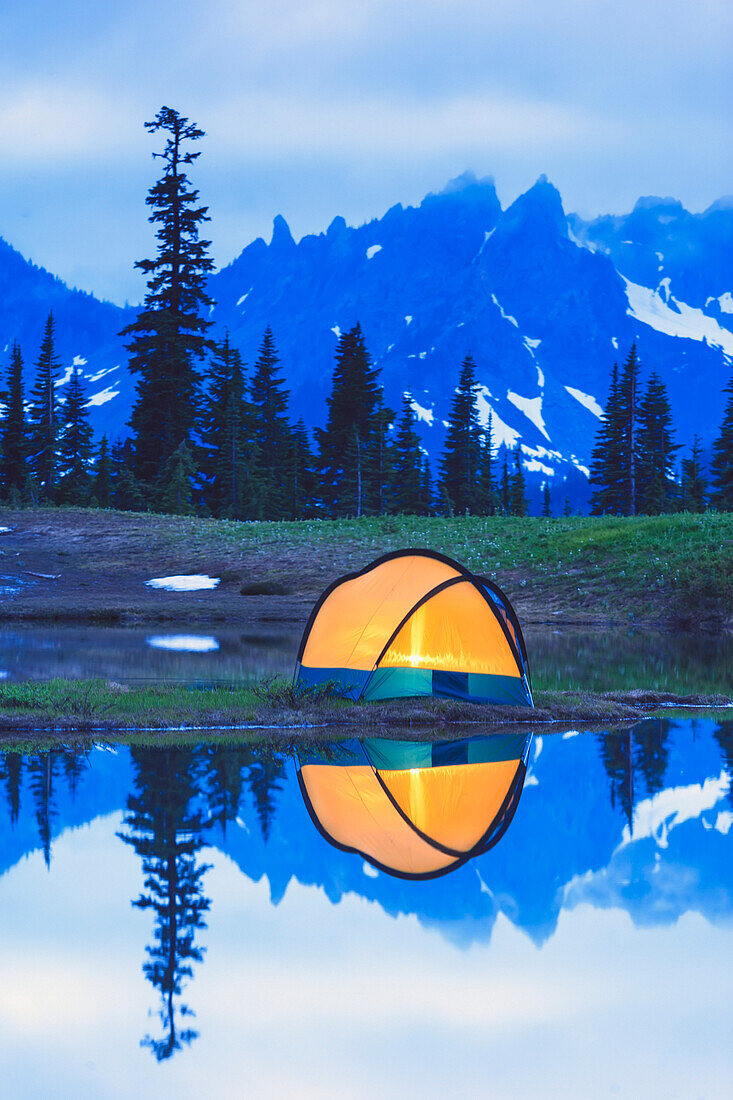 'Camping tent at sunset small reflecting pond near tipsoo lake mount rainer national park near seattle;Washington united states of america'