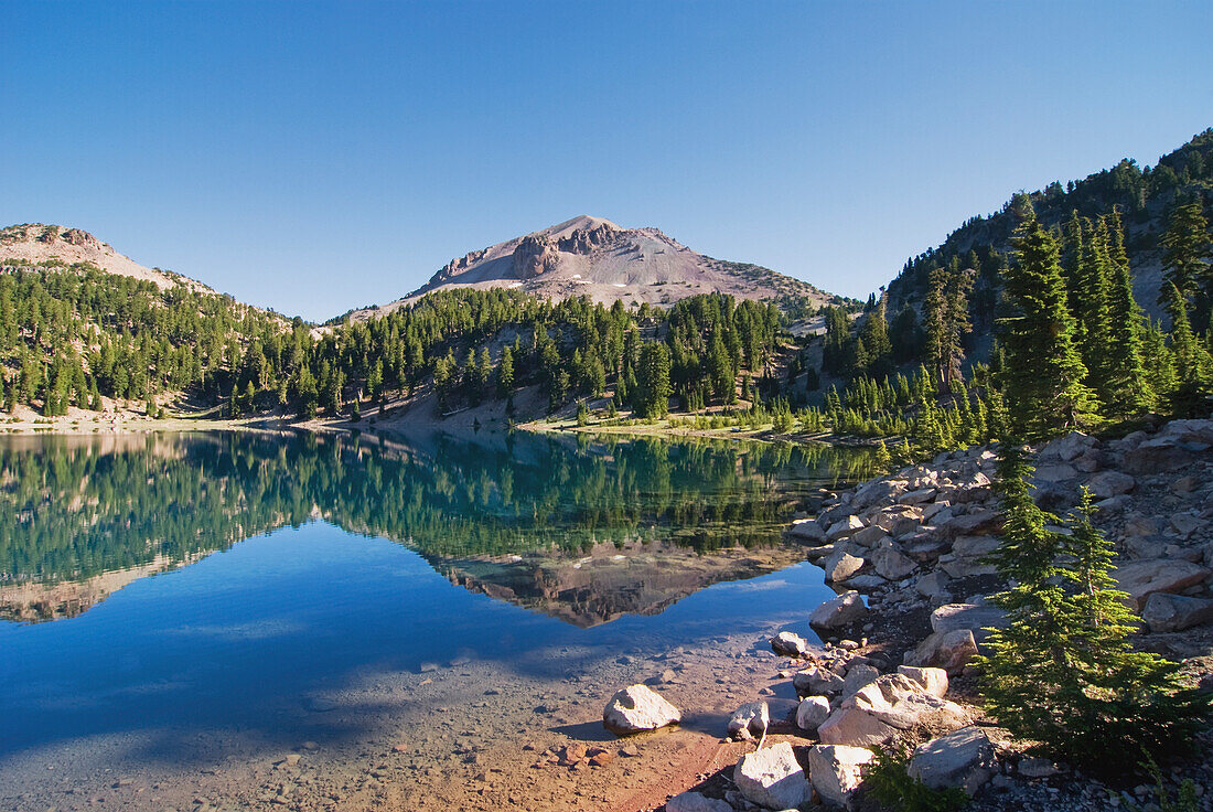'Mountain reflecting in a lake in the early morning lassen volcanic national park;California united states of america'