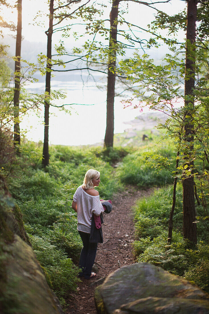 'Girl Walking Through The Forest To The Lake; Kristiansand, Norway'