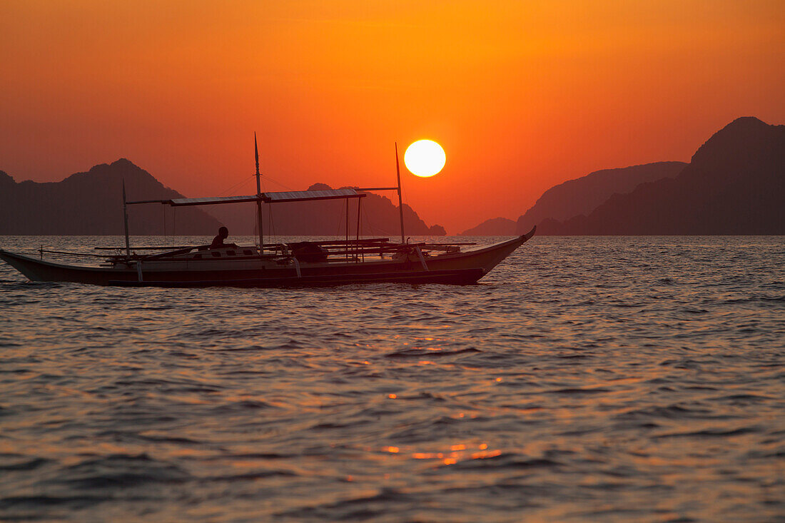 'Sunset View Of Tropical Islands And A Boat From The Beaches Of Corong Corong Near El Nido; Bacuit Archipelago, Philippines'