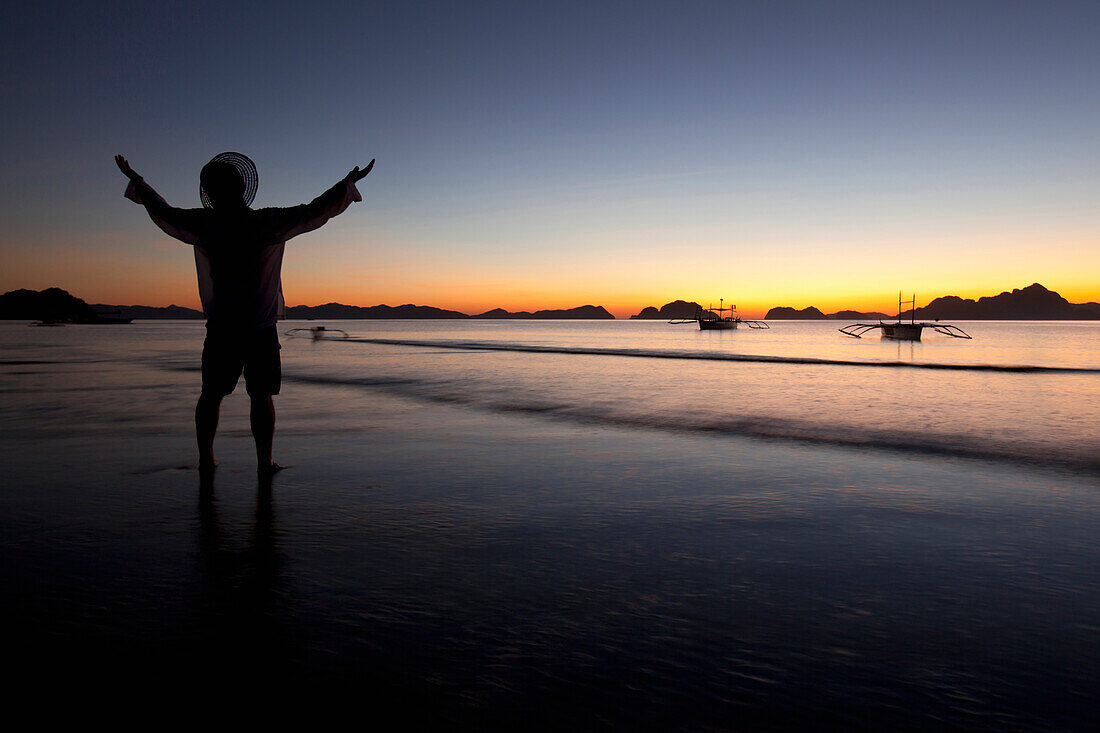 'A Man On A Beach At Sunset; Corong-Corong, Palawan, Philippines'
