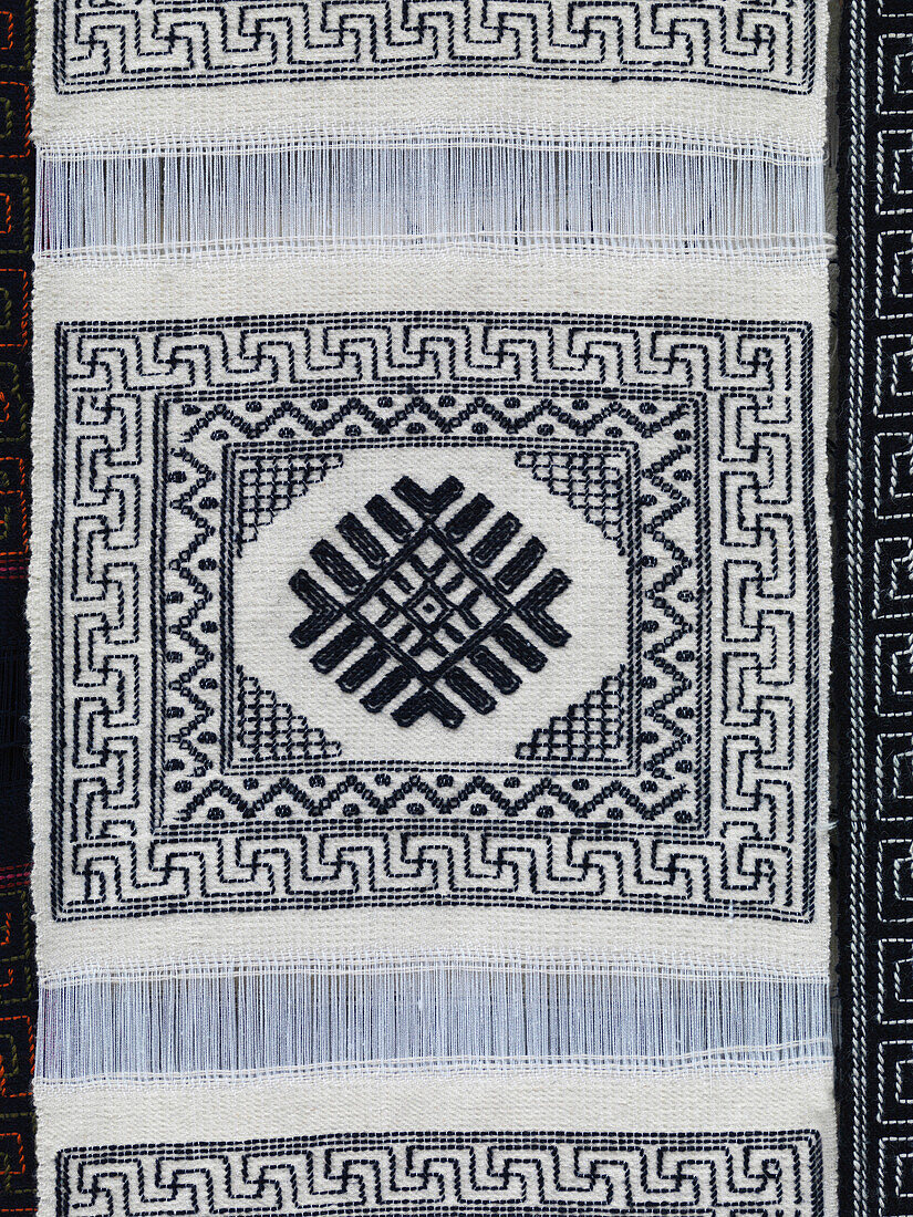 'Weaving A White And Black Design; Bumthang District Bhutan'