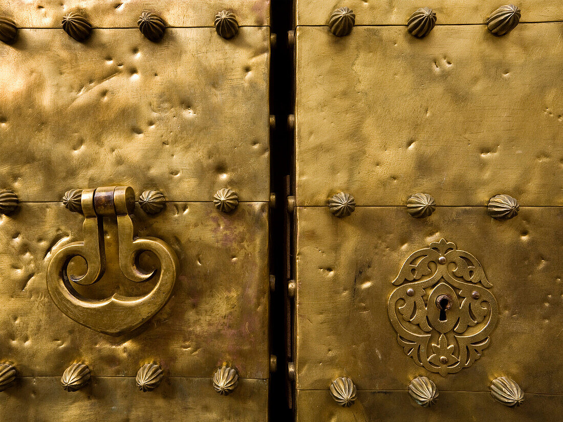 'Cordoba, Spain; Door Knocker And Keyhole On Copper Door Of La Mezquita, The Great Mosque'