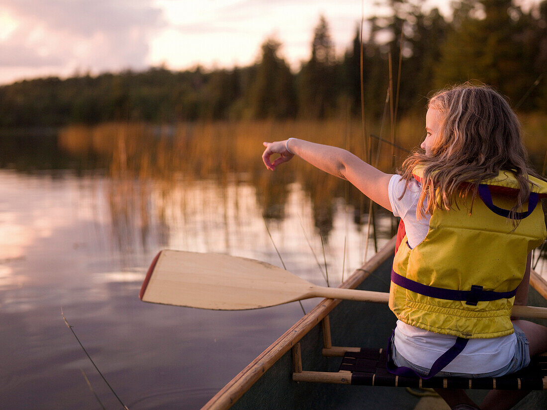 'Lake Of The Woods, Ontario, Canada; Girl In A Canoe'