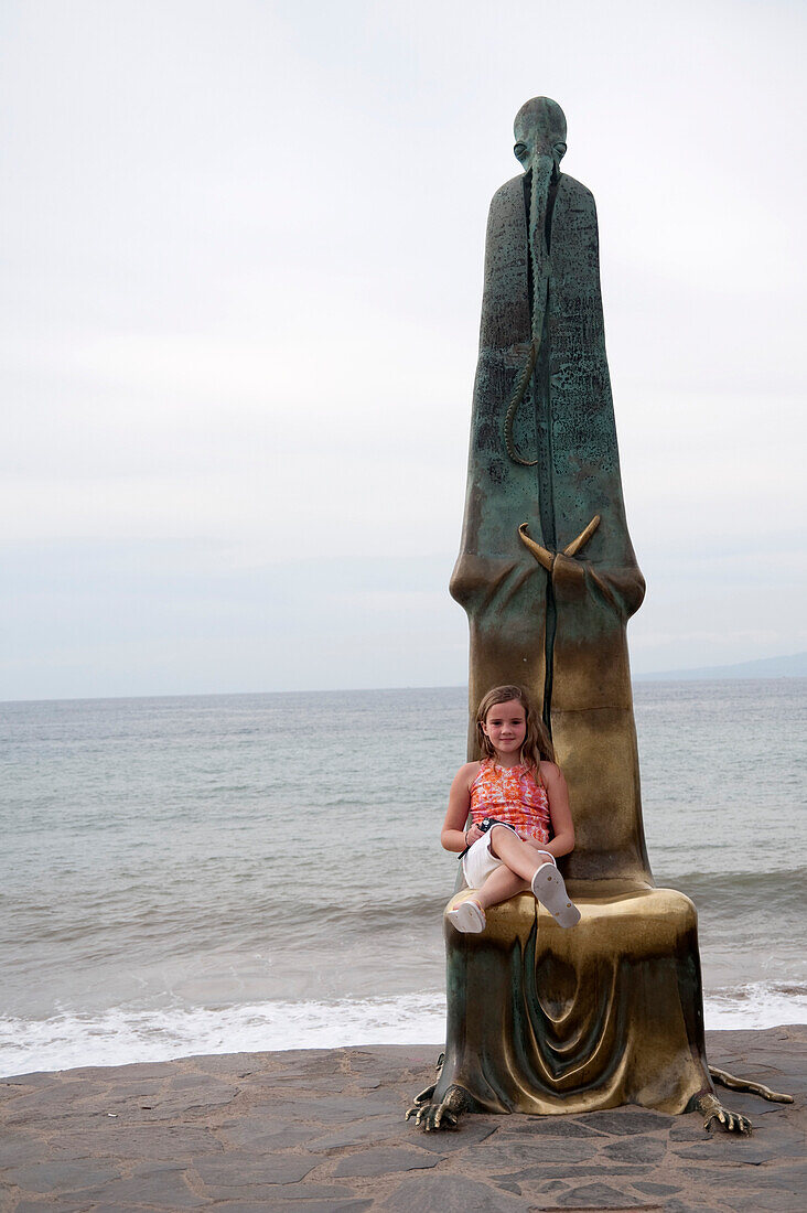 'Girl Sitting By A Statue; Puerto Vallarta, Mexico'