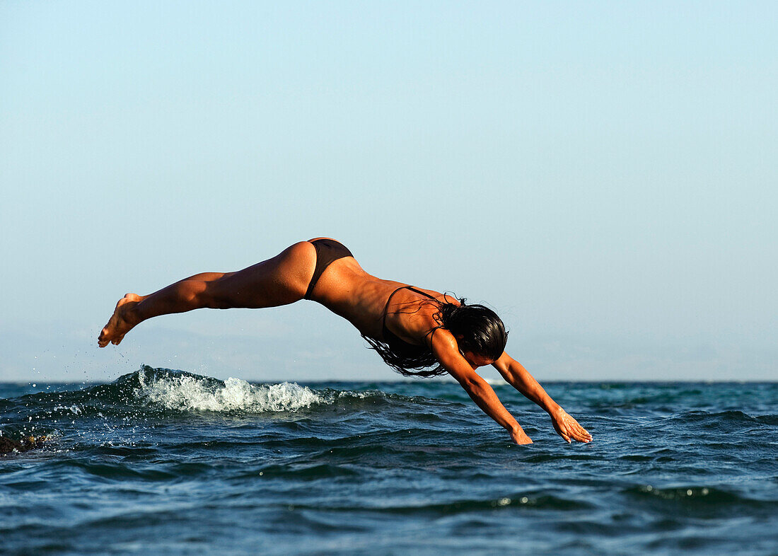 Woman Diving In The Ocean