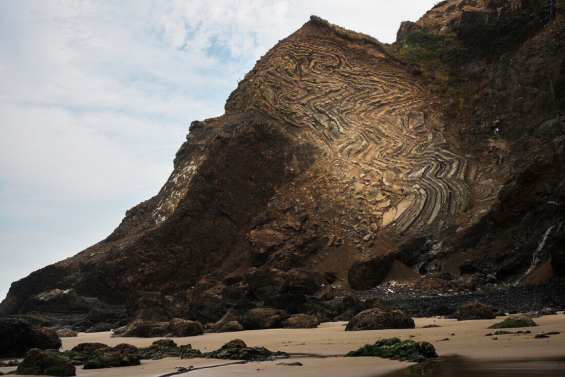 'Erosion reveals rock strata; Cannon Beach, Oregon, United States of America'