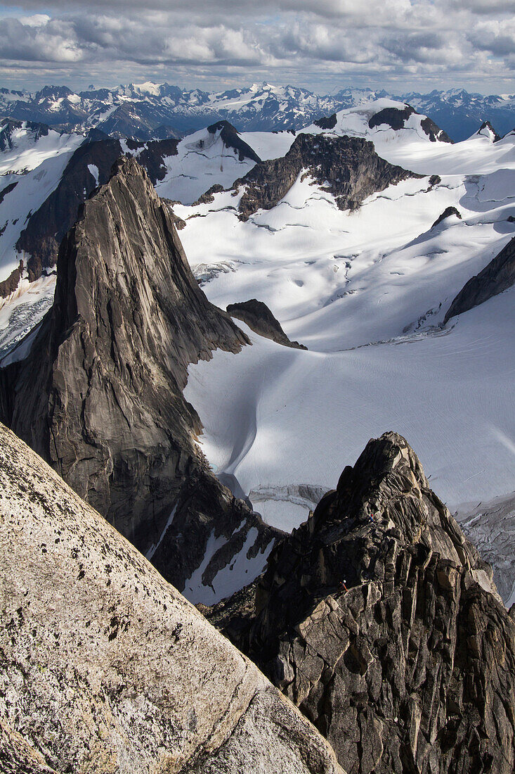 'A climber descending the Kaine Route on Bugaboo Spire, Purcell Range, Columbia Mountains; British Columbia, Canada'
