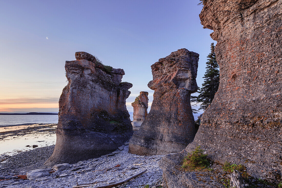 'Monolith at dawn, Anse des Bonnes Femmes at Ile Niapiskau, Mingan Archipelago National Park Reserve of Canada, Cote-Nord, Duplessis region; Quebec, Canada'