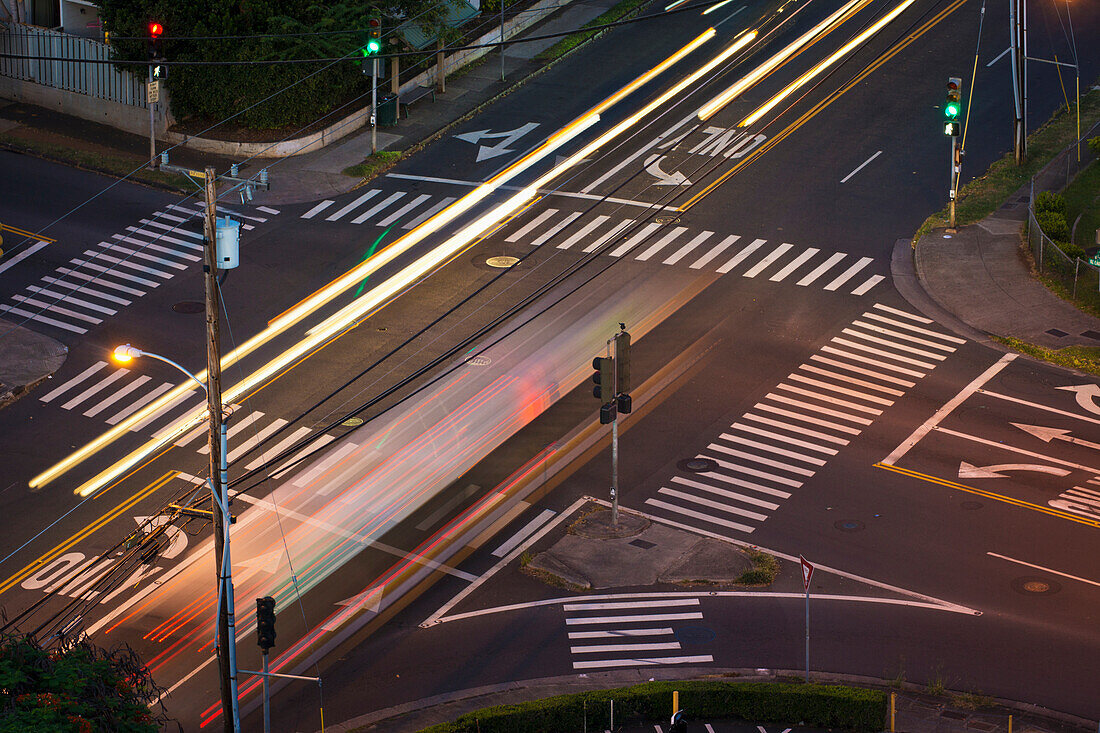 'High angle view of an intersection with painted arrows and crosswalks; Honolulu, Oahu, Hawaii, United States of America'