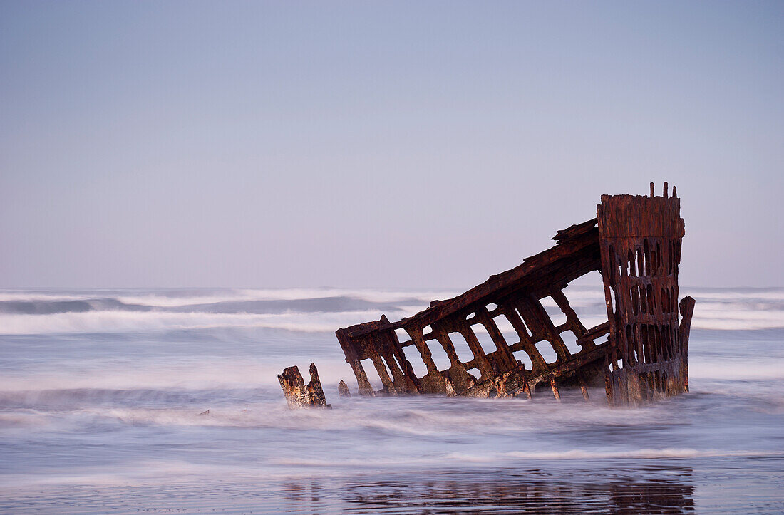 'Surf washes over the skeleton of the Peter Iredale; Oregon, United States of America'